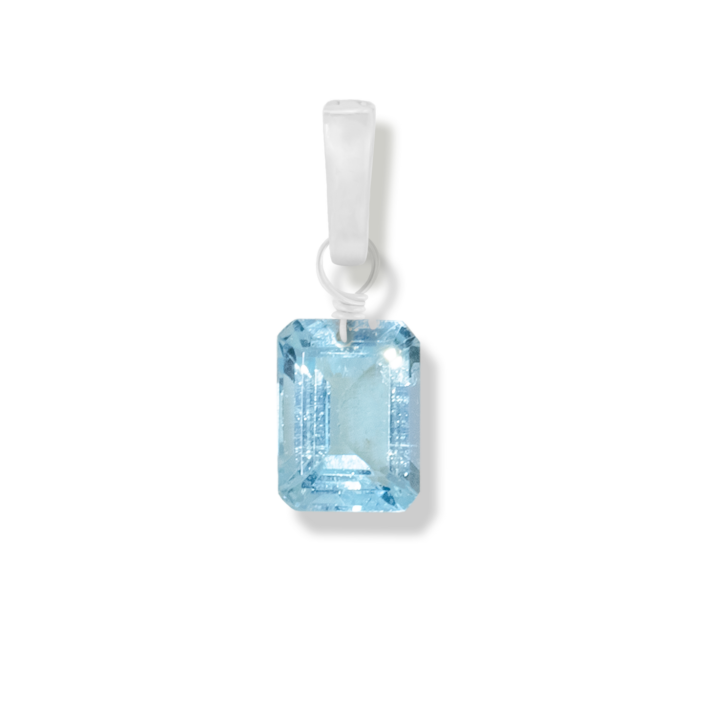 blue topaz rectangle cut charm on a white background.