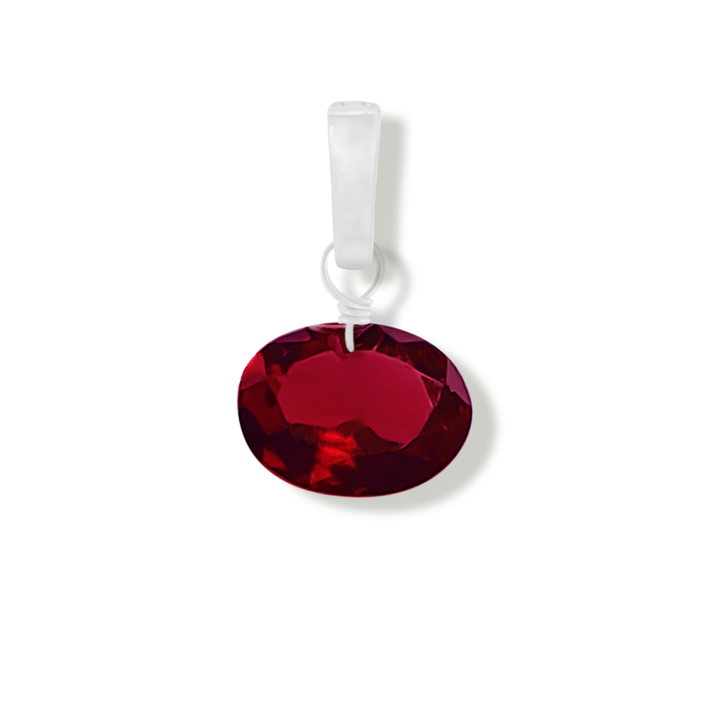 garnet oval cut gemstone charm on a white background
