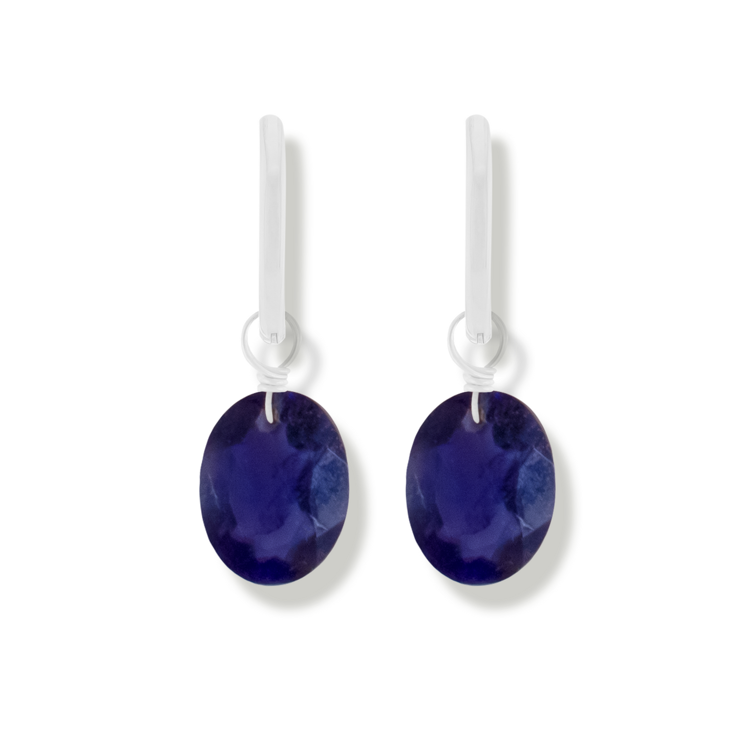 pair of silver earrings with iolite oval cut gemstones.