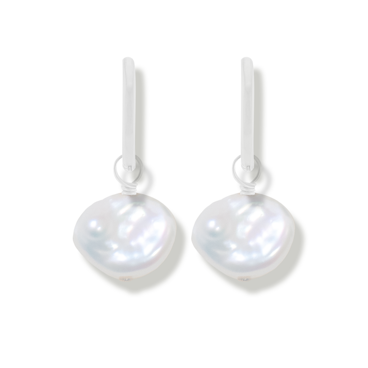 pair of silver earring with keishi pearls on a white background
