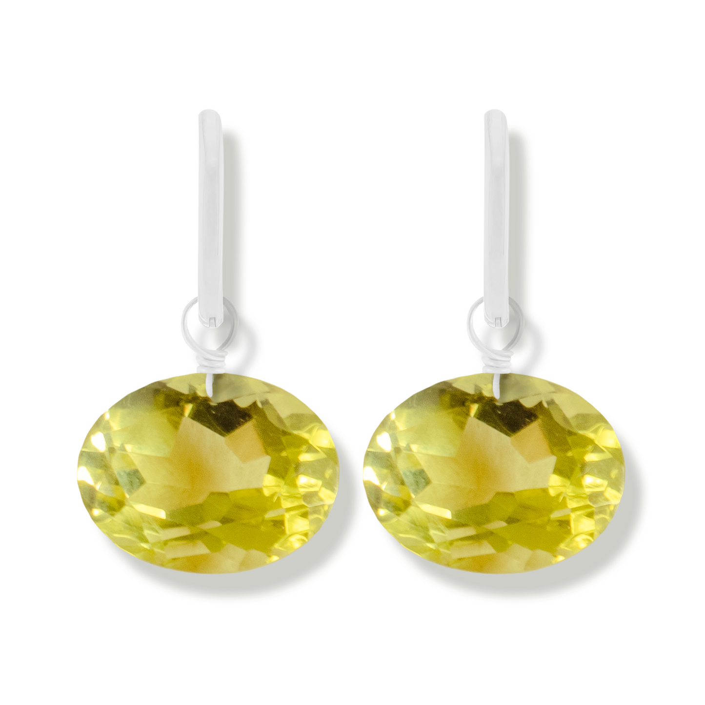 pair of silver earrings with lemon quartz oval cut gemstones.