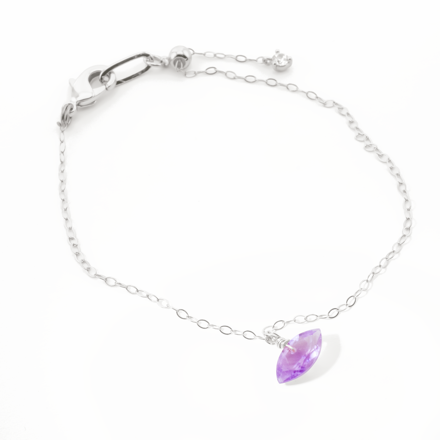 Sterling Silver bracelet with a amethyst marquise cut gemstone on a white background