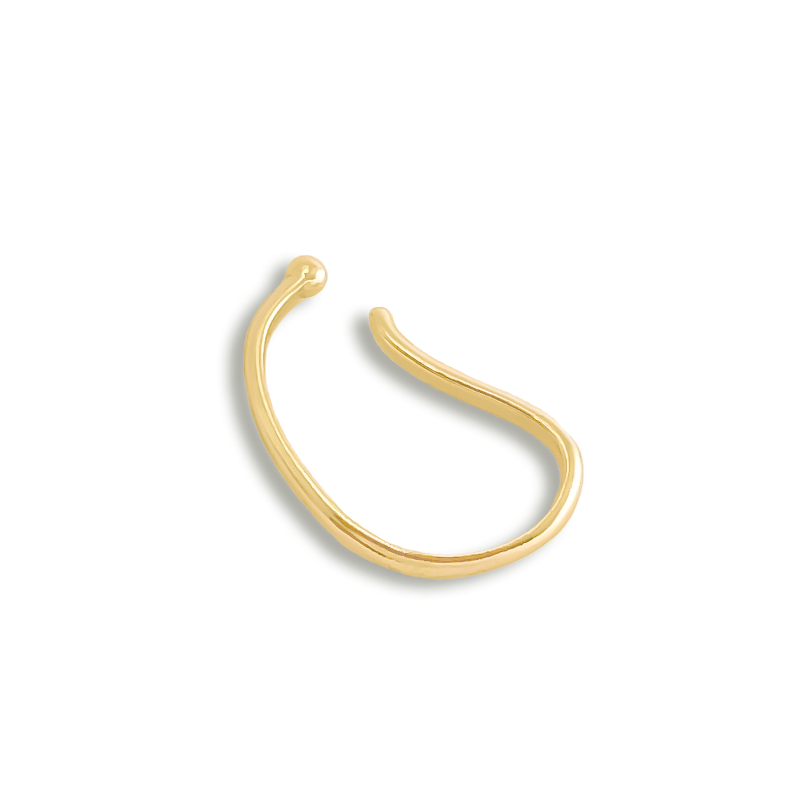 A single gold-colored ear cuff on a white background