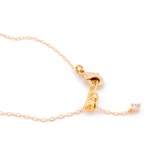 closeup of gold adjustable slider clasp necklace