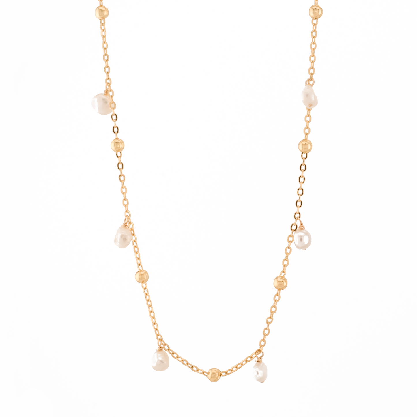 gold necklace with gold beads and baroque pearls on a white background.