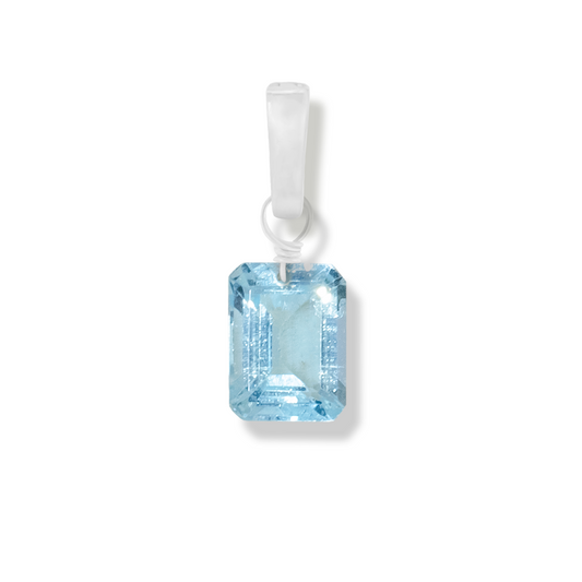 blue topaz rectangle cut charm on a white background.
