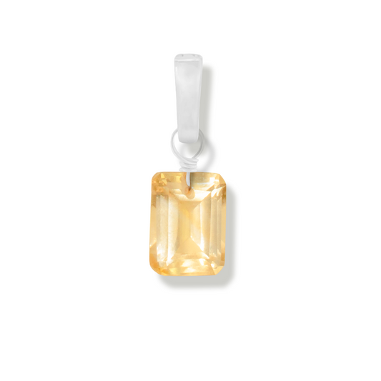 citrine rectangle cut gemstone charm on a white background.