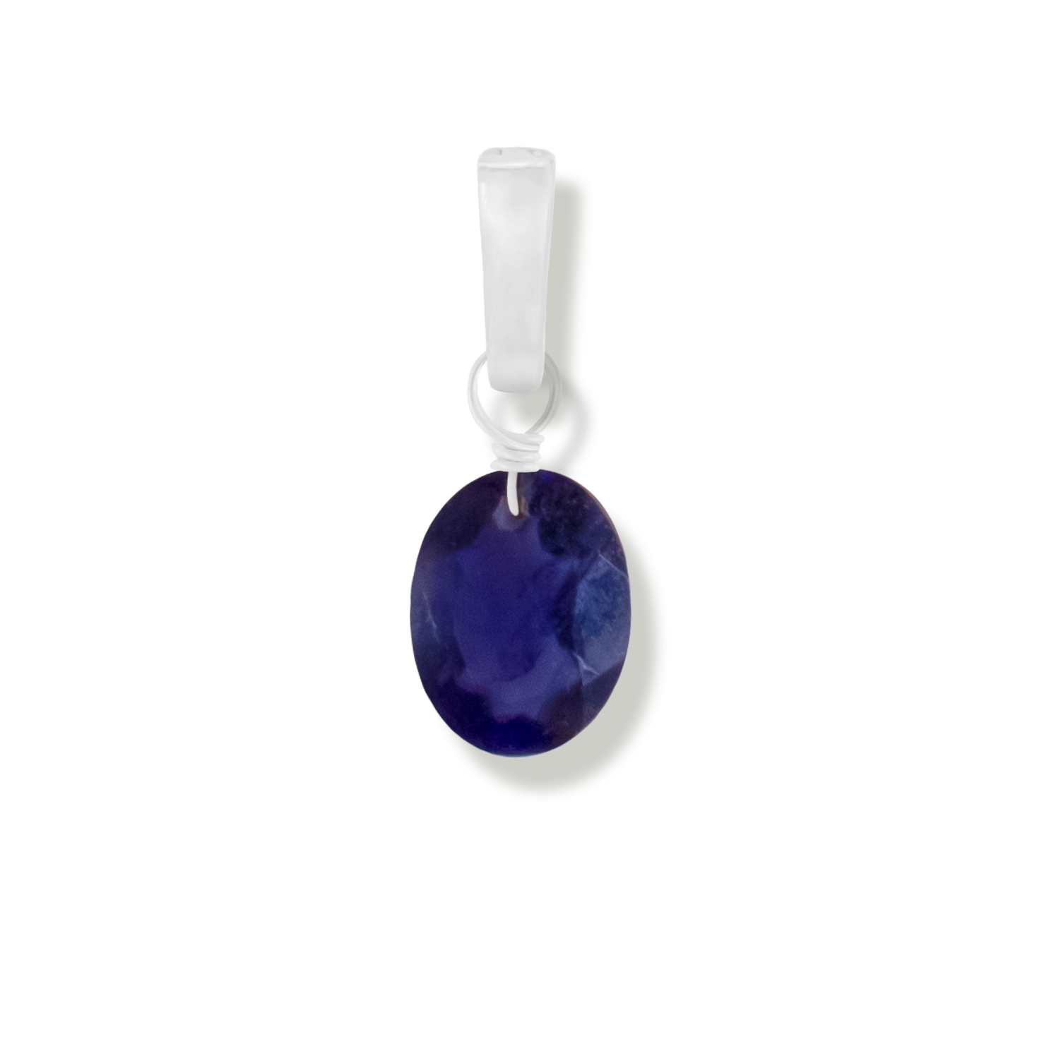 Iolite oval cut gemstone charm on a white background.