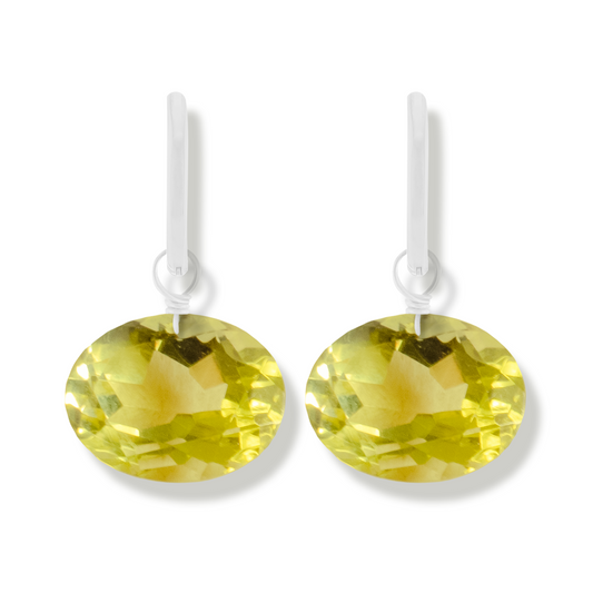 pair of silver earrings with lemon quartz oval cut gemstones.