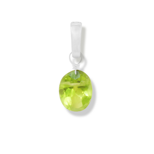 Peridot oval cut charm on a white background.