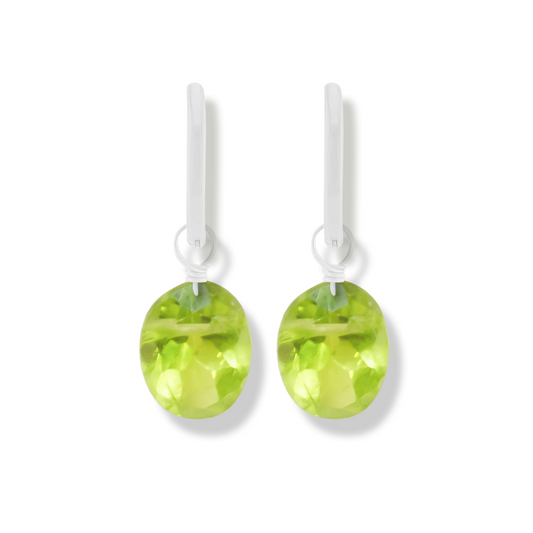 pair of silver earrings with peridot oval cut gemstones.