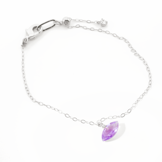 Sterling Silver bracelet with a amethyst marquise cut gemstone on a white background