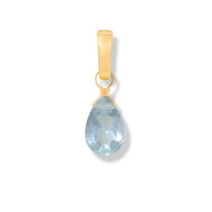 Gold pendant with a aquamarine pear cut gemstone on a white background