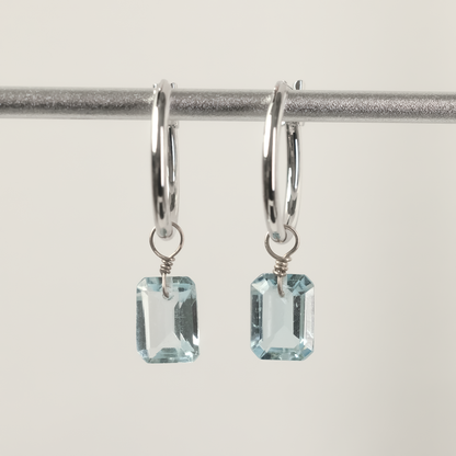 Blue Topaz Emerald Cut Rhodium Hoop Earrings