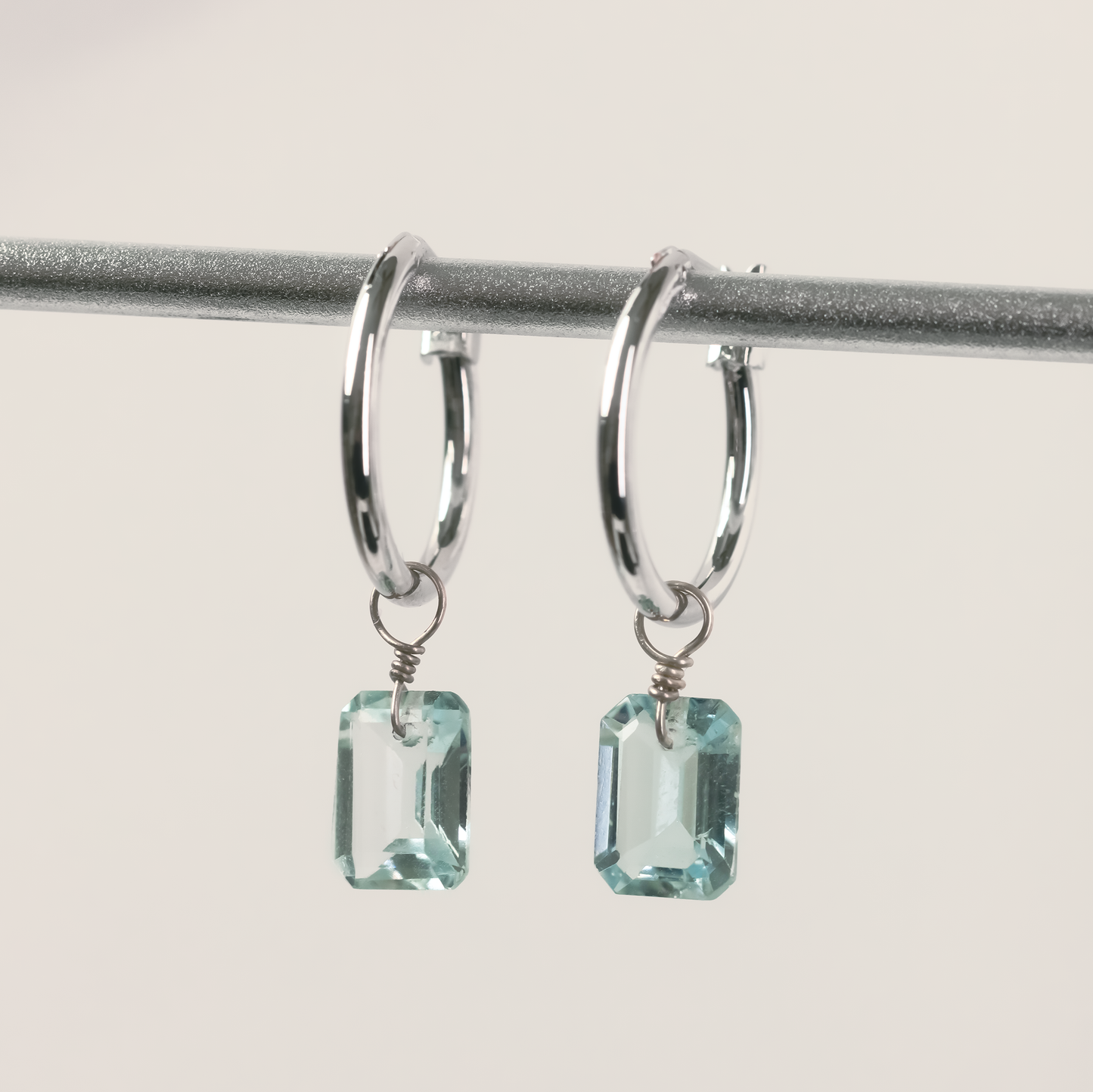 Blue Topaz Emerald Cut Rhodium Hoop Earrings