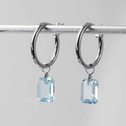 Blue Topaz Emerald Cut Rhodium Hoop Earrings