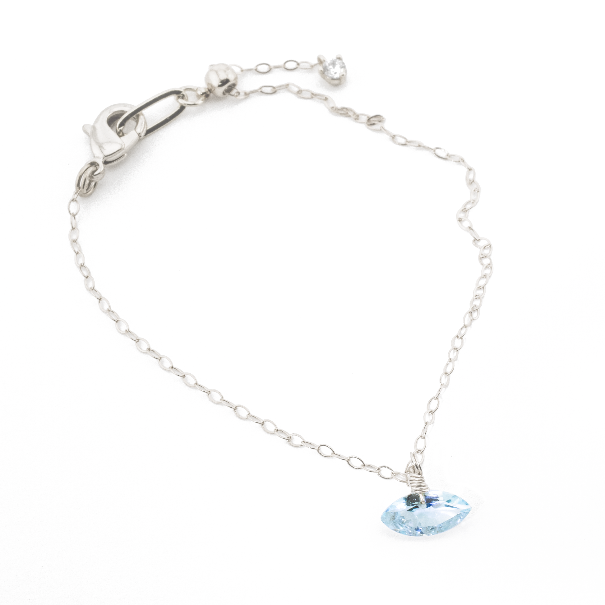 Sterling Silver bracelet with a blue topaz marquise cut gemstone on a white background