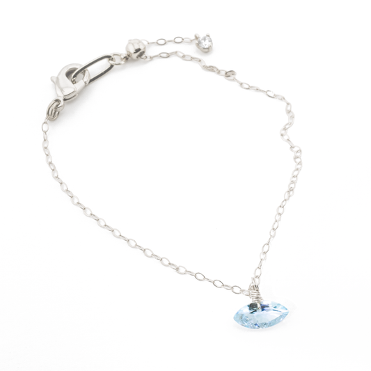 Sterling Silver bracelet with a blue topaz marquise cut gemstone on a white background