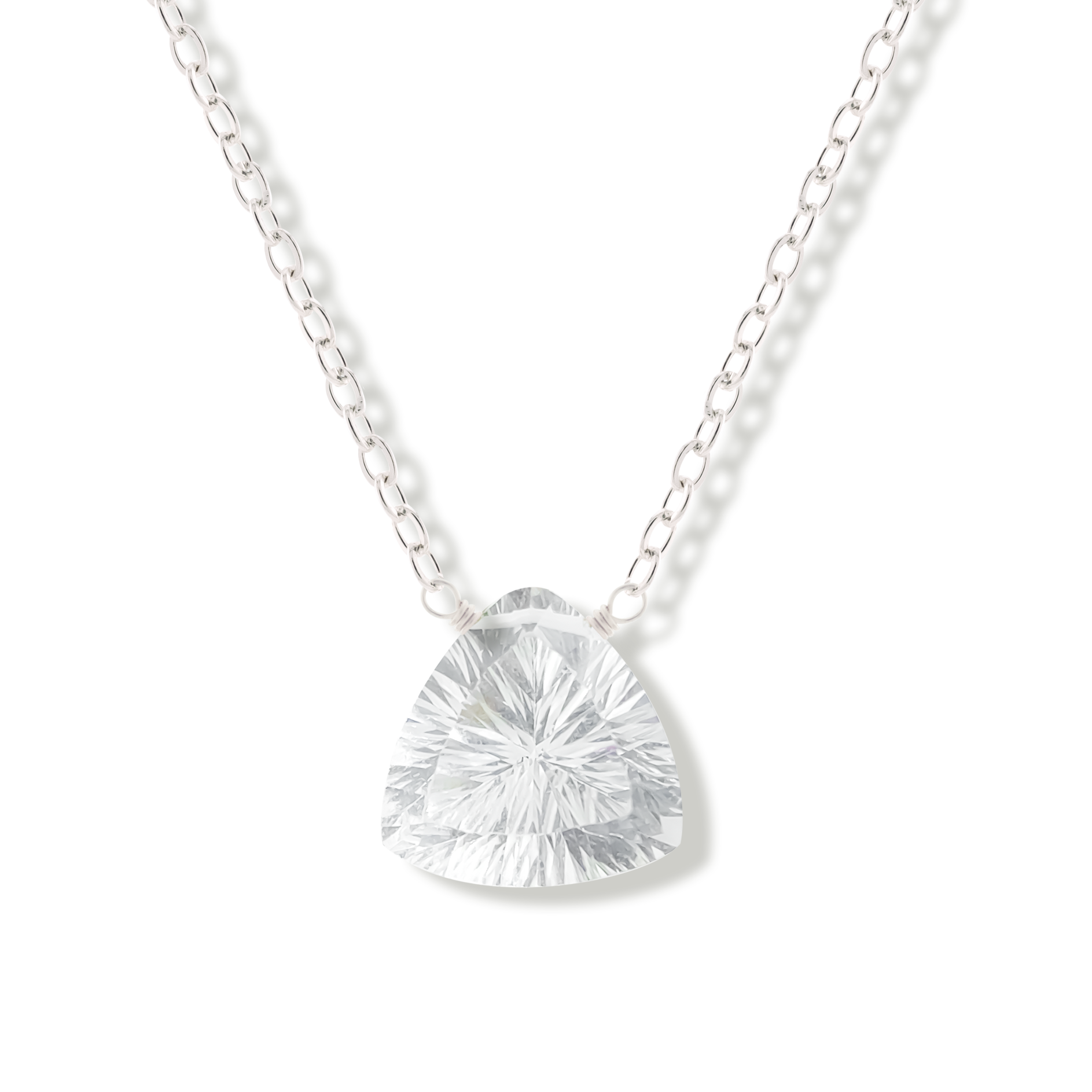 Silver necklace with a rock crystal gemstone pendant on a white background