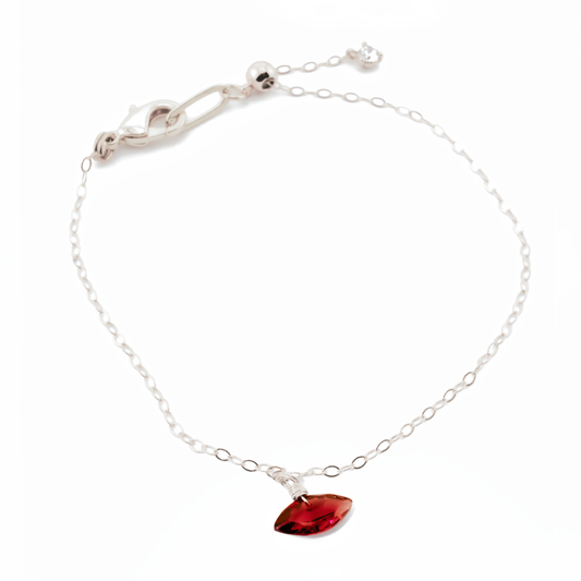 Sterling Silver bracelet with a garnet marquise cut gemstone on a white background
