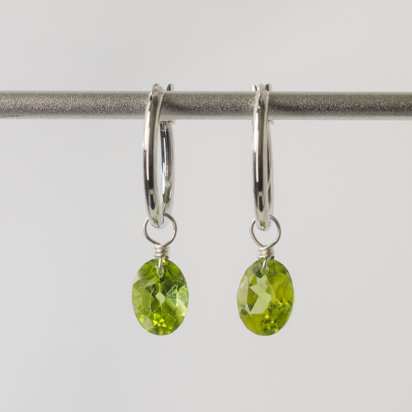 Peridot Oval Cut Rhodium Hoop Earring