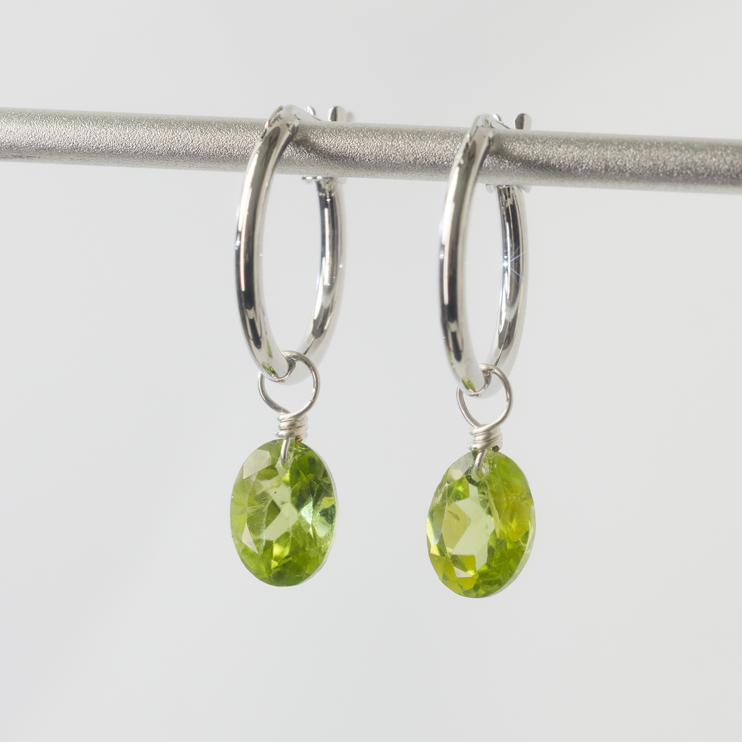 Peridot Oval Cut Rhodium Hoop Earring