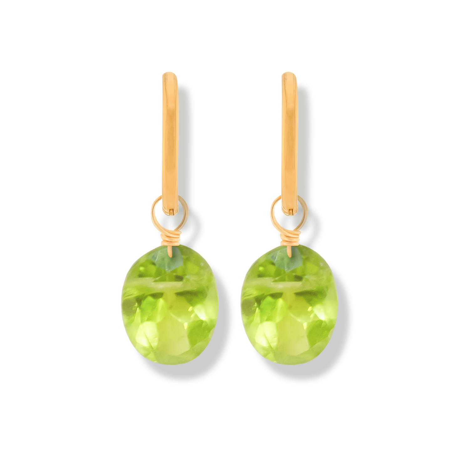 pair of 14k gold-filled hoop earrings with peridot oval cut gemstones on a white background.