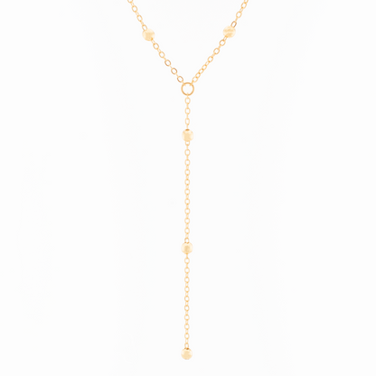 A gold-filled chain lariat necklace with beads, displayed against a white background.