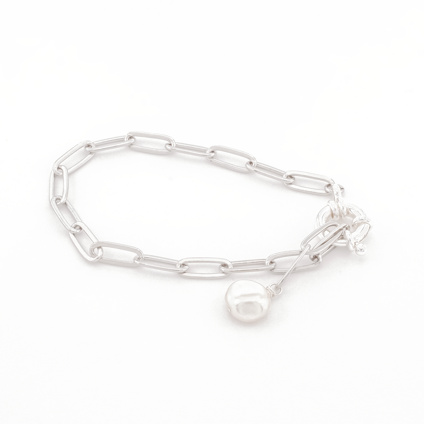silver paperclip chain bracelet with keishi pearl charm on a white background.