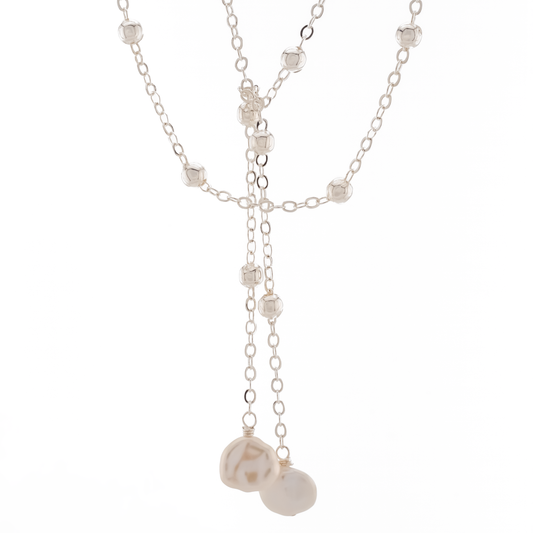 sterling silver over brass satellite chain wrap necklace with keishi pearl drops on a white background.
